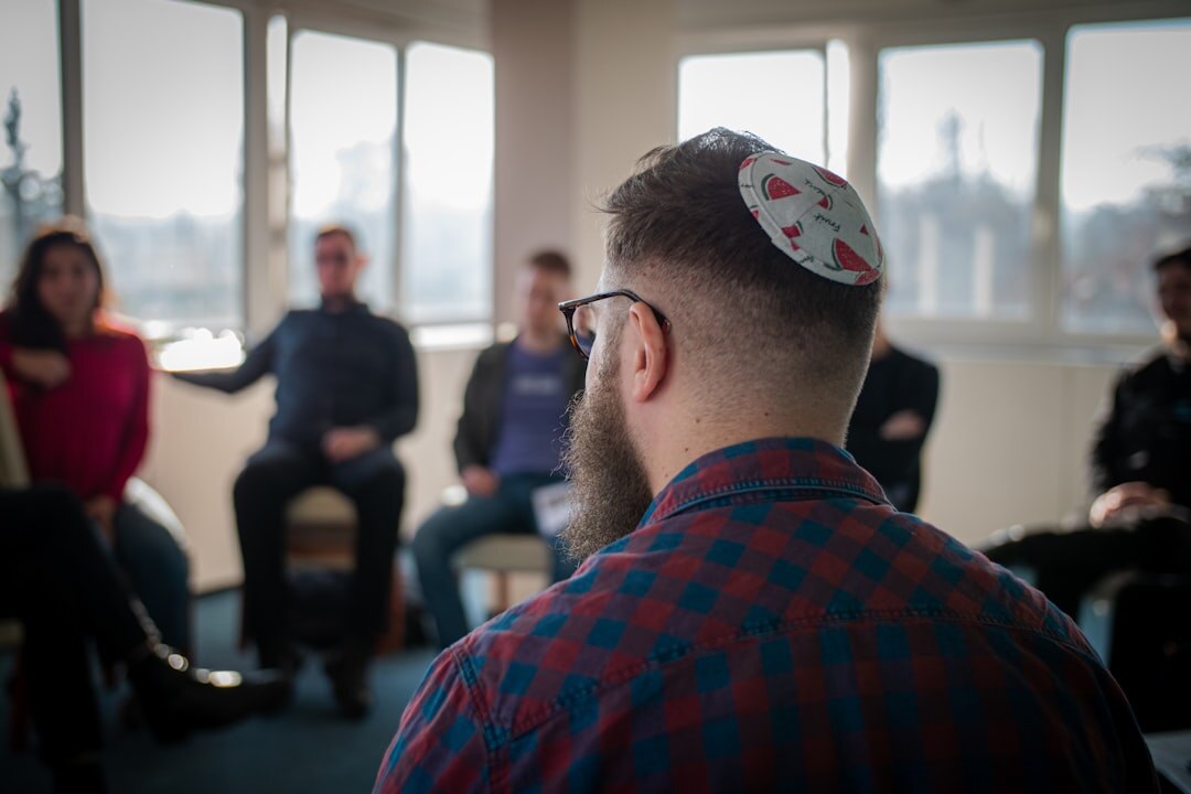 Group of professionals discussing in a circle during a forum session
